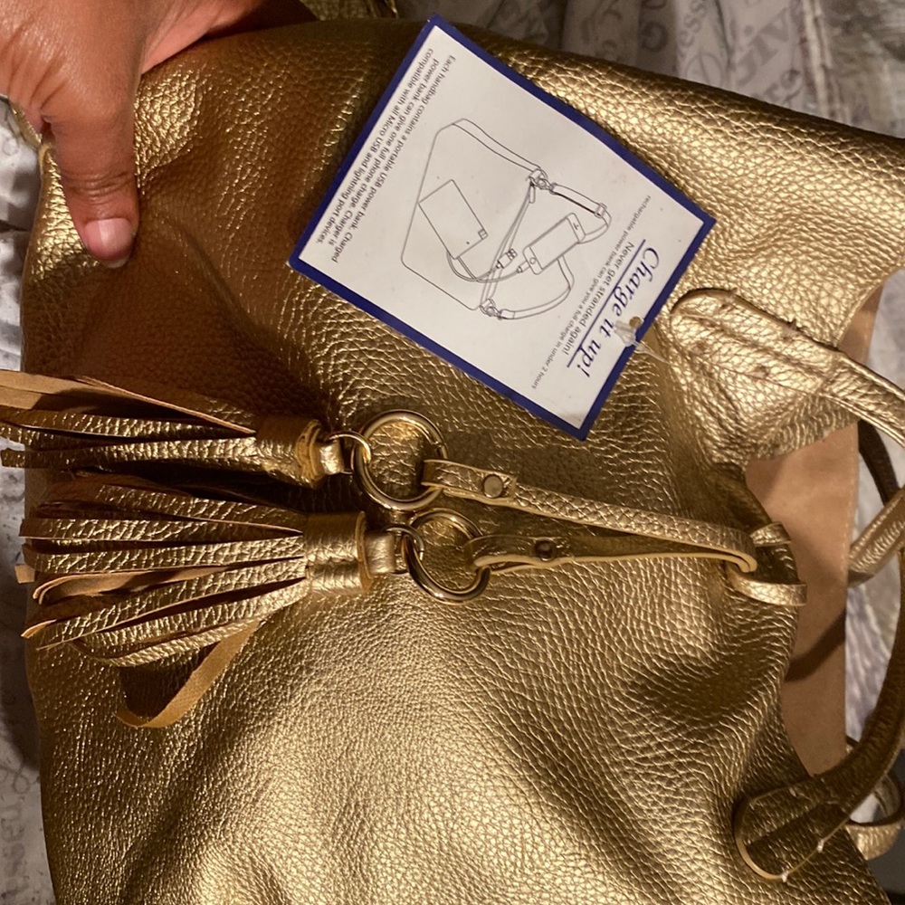 Charming Charlie Gold Bag with built in charger